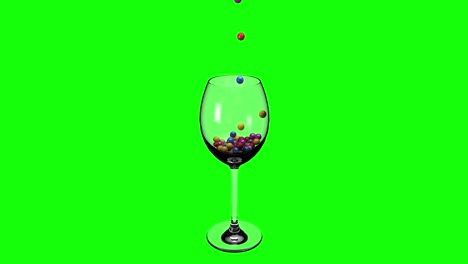 Colorful-sphere-balls-falling-into-a-glass-wine-cup